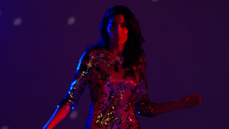 Close-Up-Of-Woman-In-Nightclub-Bar-Or-Disco-Dancing-With-Sparkling-Lights-9